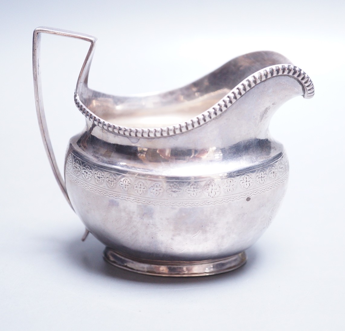 A George III silver cream jug, Thomas Law, Sheffield, 1808, height 9.8cm, 122 grams.